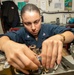 Sailor Installs Actuator In Bomb Rack