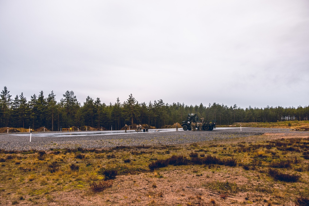 U.S. Marines conduct helicopter support team resupply with Finnish Soldiers