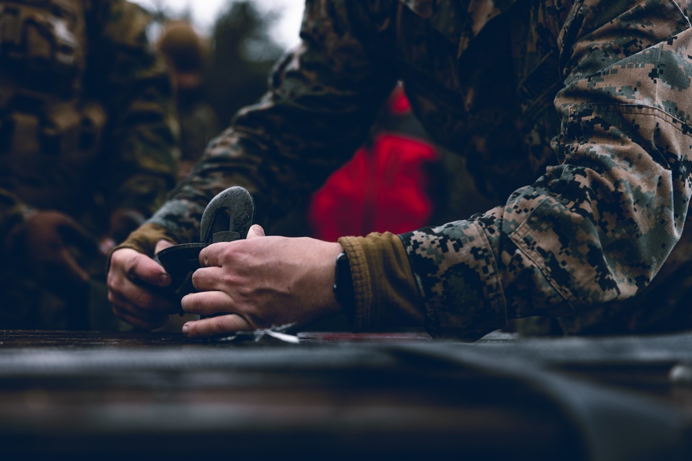 U.S. Marines conduct helicopter support team resupply with Finnish Soldiers