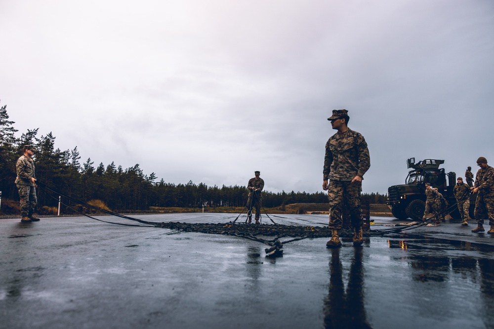 U.S. Marines conduct helicopter support team resupply with Finnish Soldiers