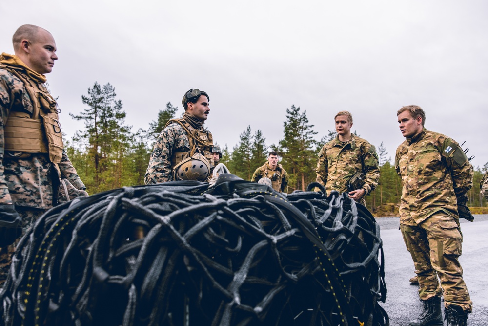 U.S. Marines conduct helicopter support team resupply with Finnish Soldiers