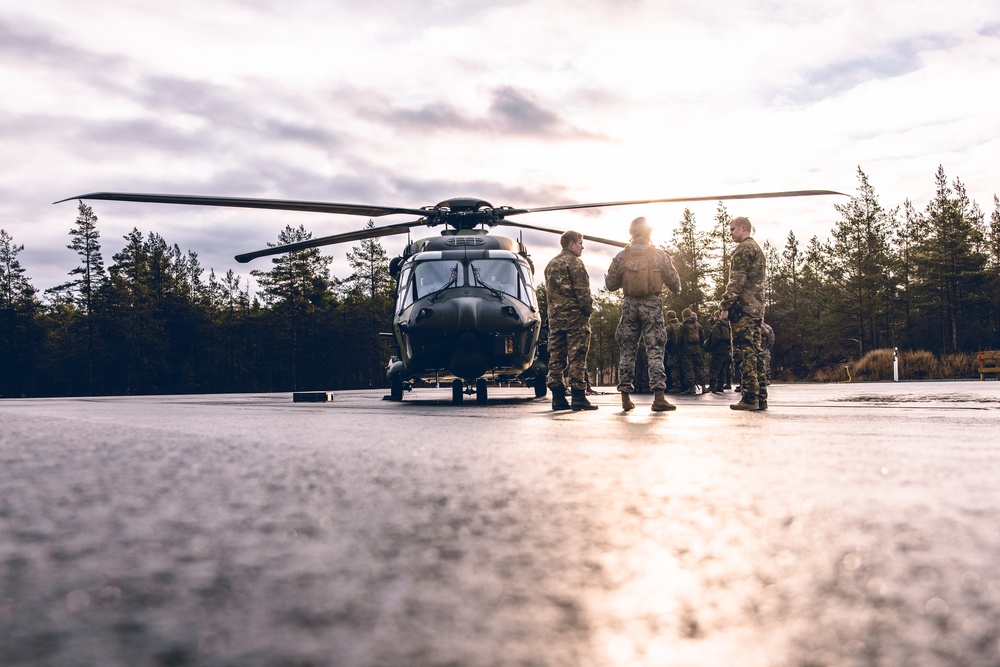 U.S. Marines conduct helicopter support team resupply with Finnish Soldiers