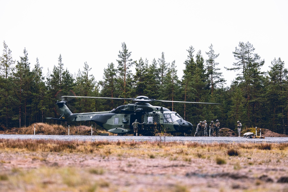 U.S. Marines conduct helicopter support team resupply with Finnish Soldiers