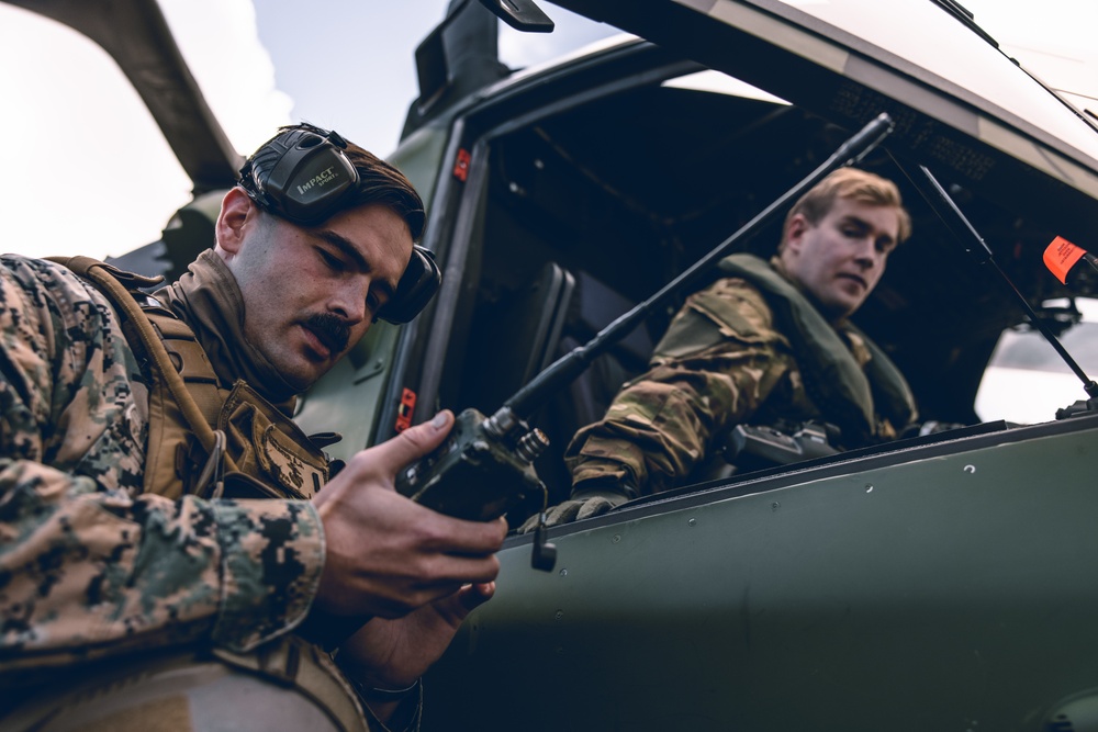 U.S. Marines conduct helicopter support team resupply with Finnish Soldiers