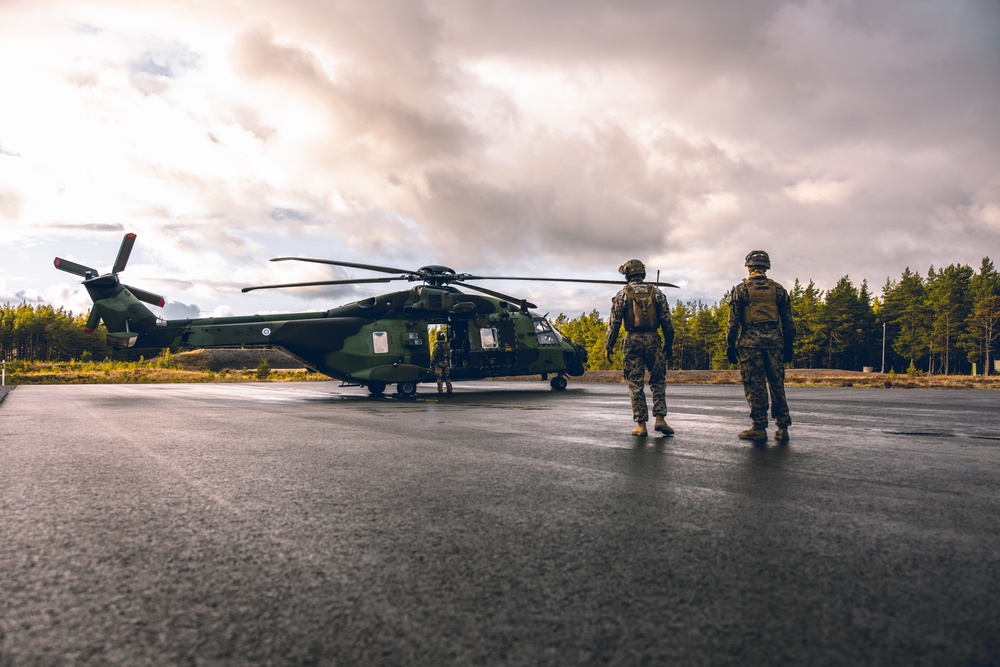 U.S. Marines conduct helicopter support team resupply with Finnish Soldiers