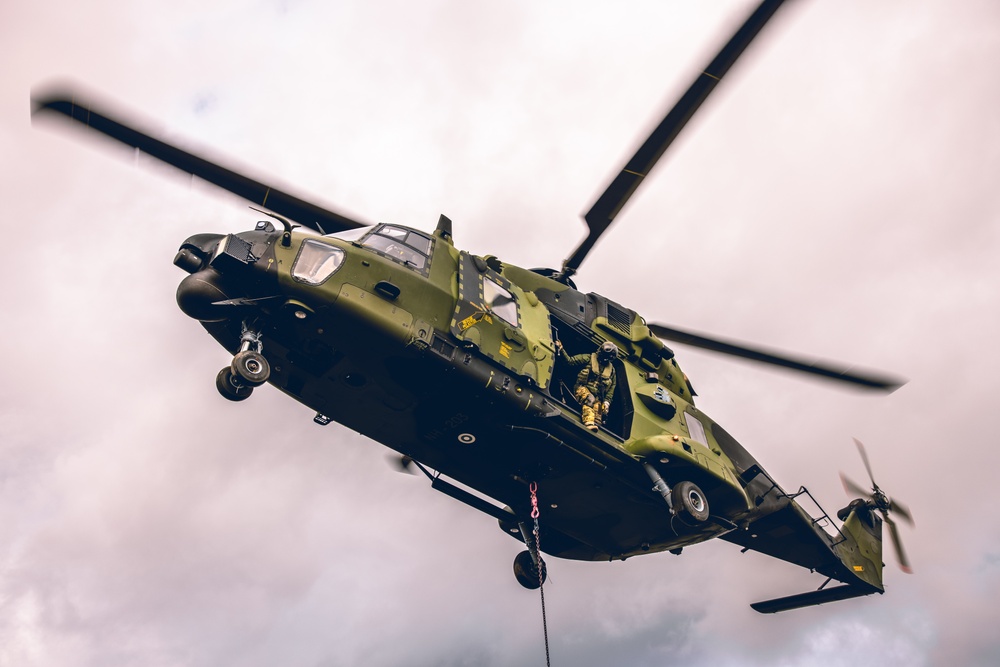 U.S. Marines conduct helicopter support team resupply with Finnish Soldiers