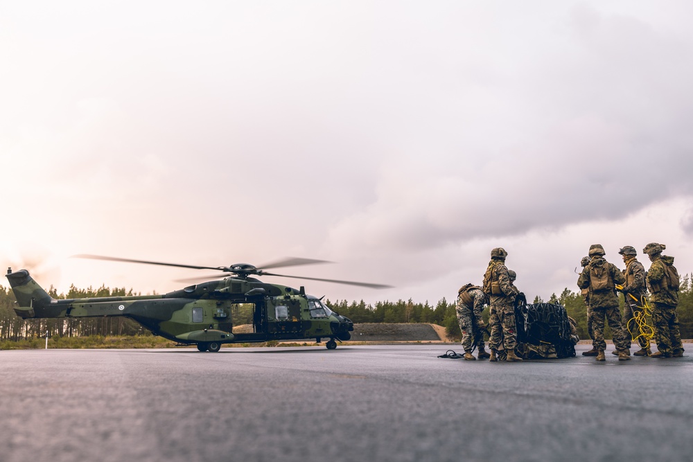 U.S. Marines conduct helicopter support team resupply with Finnish Soldiers