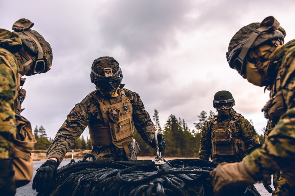 U.S. Marines conduct helicopter support team resupply with Finnish Soldiers