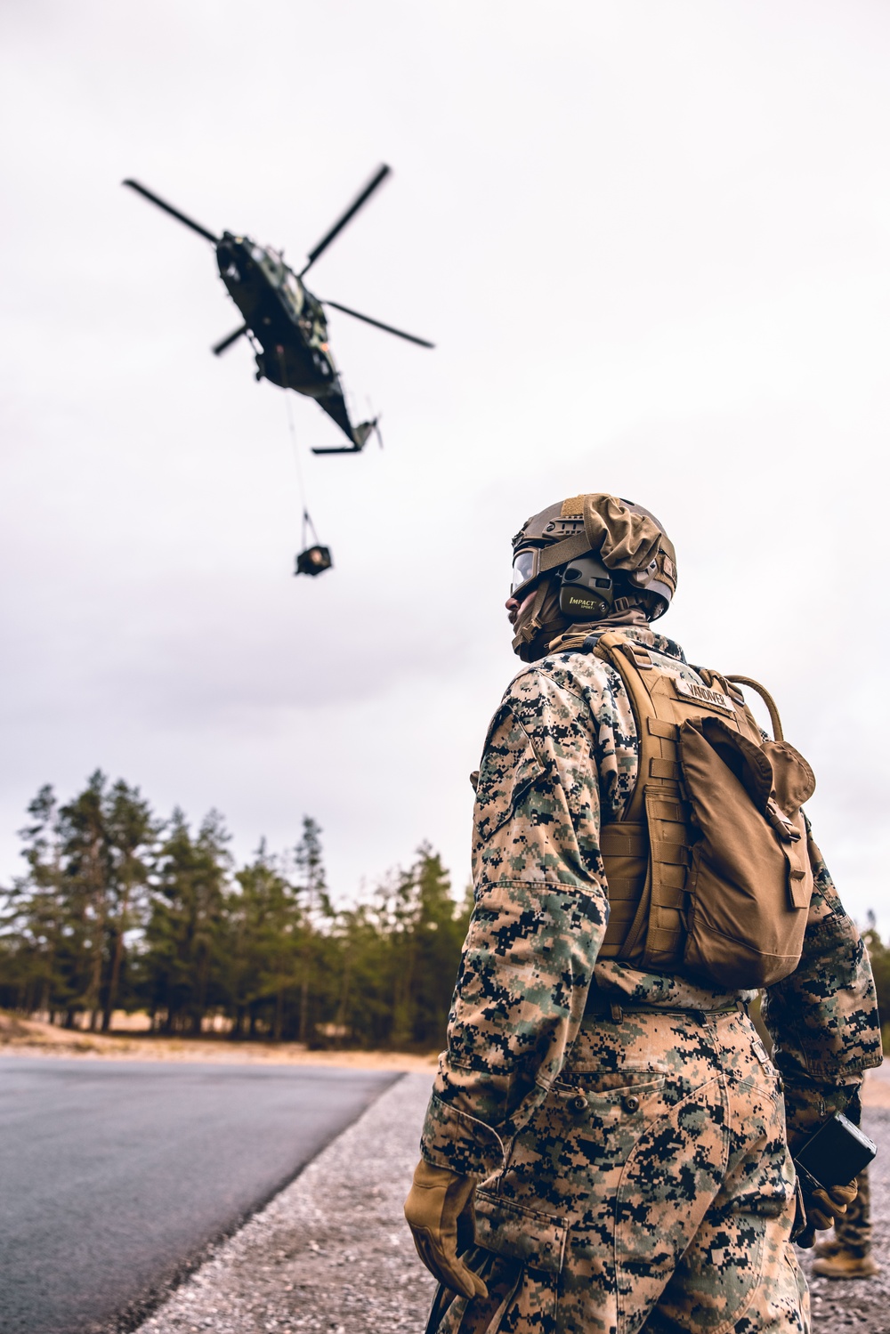 U.S. Marines conduct helicopter support team resupply with Finnish Soldiers