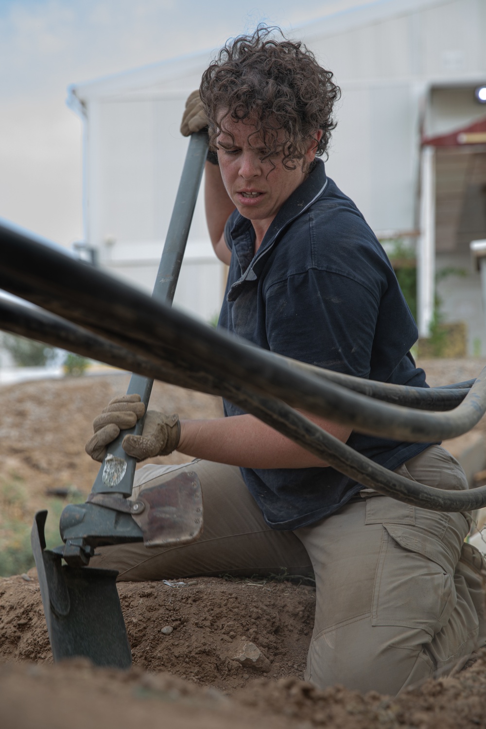 Prime Power Production Specialist Digs Trench