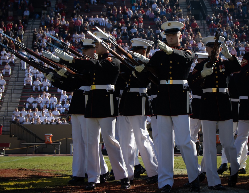 Marines with “The Silent Drill Platoon,” Marine Barracks Washington, perform for thousands of cadets and family members, during a Virginia Military Institute football game.