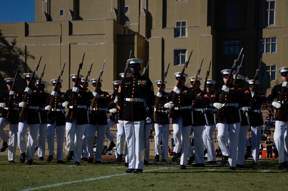 Marines with “The Silent Drill Platoon,” Marine Barracks Washington, perform for thousands of cadets and family members, during a Virginia Military Institute football game.