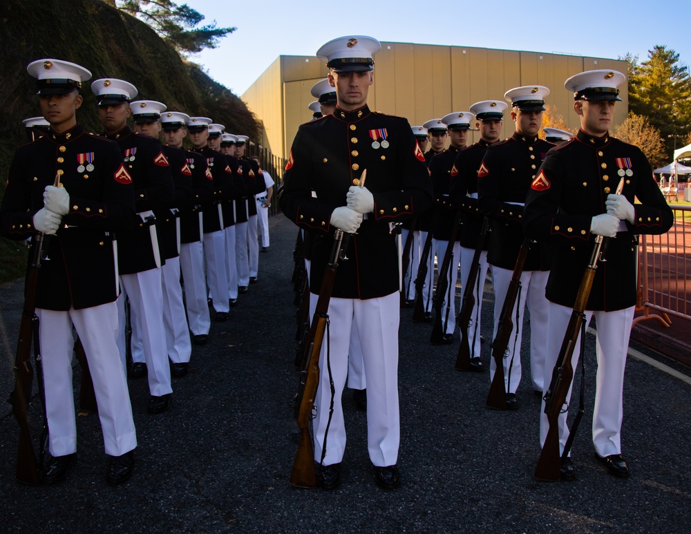 Marines with “The Silent Drill Platoon,” Marine Barracks Washington, perform for thousands of cadets and family members, during a Virginia Military Institute football game.