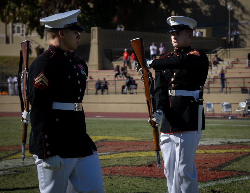 Marines with “The Silent Drill Platoon,” Marine Barracks Washington, perform for thousands of cadets and family members, during a Virginia Military Institute football game.