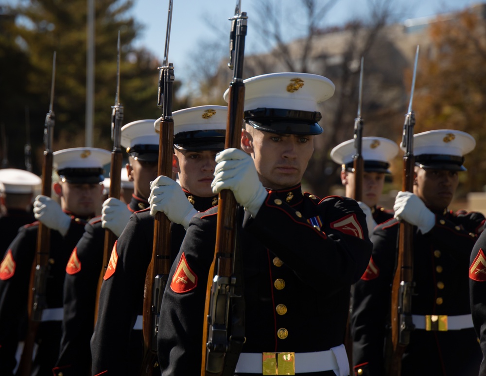 Marines with “The Silent Drill Platoon,” Marine Barracks Washington, perform for thousands of cadets and family members, during a Virginia Military Institute football game.