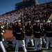 Marines with “The Silent Drill Platoon,” Marine Barracks Washington, perform for thousands of cadets and family members, during a Virginia Military Institute football game.