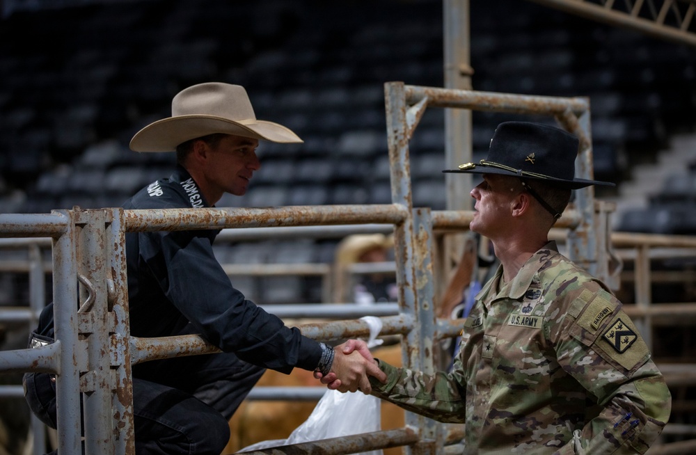 1st Infantry Division Commanding General's Mounted Color Guard participate in Professional Armed Forces Rodeo