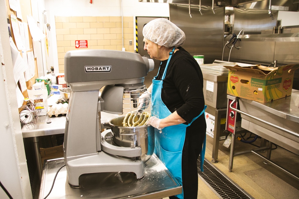 Adele La Fleur mixing the ingredients for Banana Nut Bread