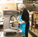 Adele La Fleur mixing the ingredients for Banana Nut Bread