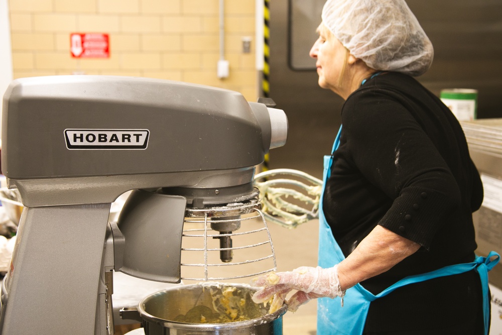 Adele La Fleur mixing the ingredients for Banana Nut Bread