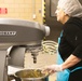 Adele La Fleur mixing the ingredients for Banana Nut Bread