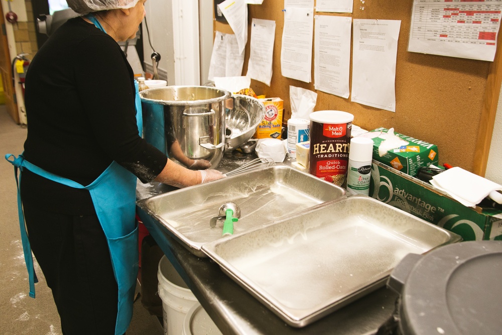 Adele La Fleur prepares and pans the Banana Nut Bread for the oven