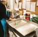 Adele La Fleur prepares and pans the Banana Nut Bread for the oven