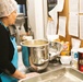Adele La Fleur prepares and pans the Banana Nut Bread for the oven
