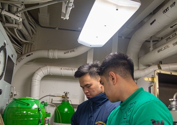 USS Ronald Reagan (CVN 76) Sailors test air regulators