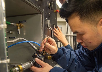 USS Ronald Reagan (CVN 76) Sailors test air regulators