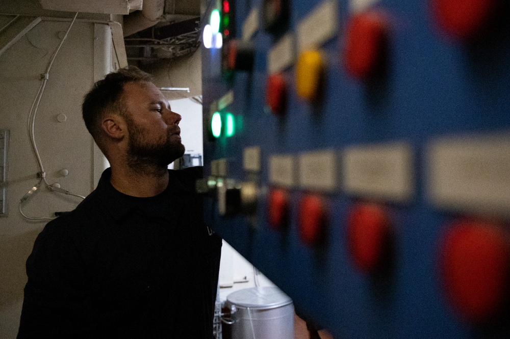 Coast Guard Cutter Hamilton crewmembers operate the incinerator while underway on the Atlantic Ocean