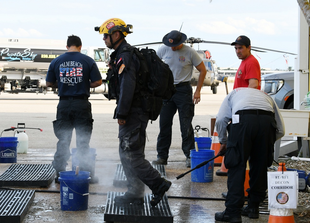 FEMA Urban Search and Rescue Go Through Decontamination At the Completion of the Daily Mission