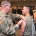 Photo of 116th Medical Group Airman administering flu vaccination to wing members