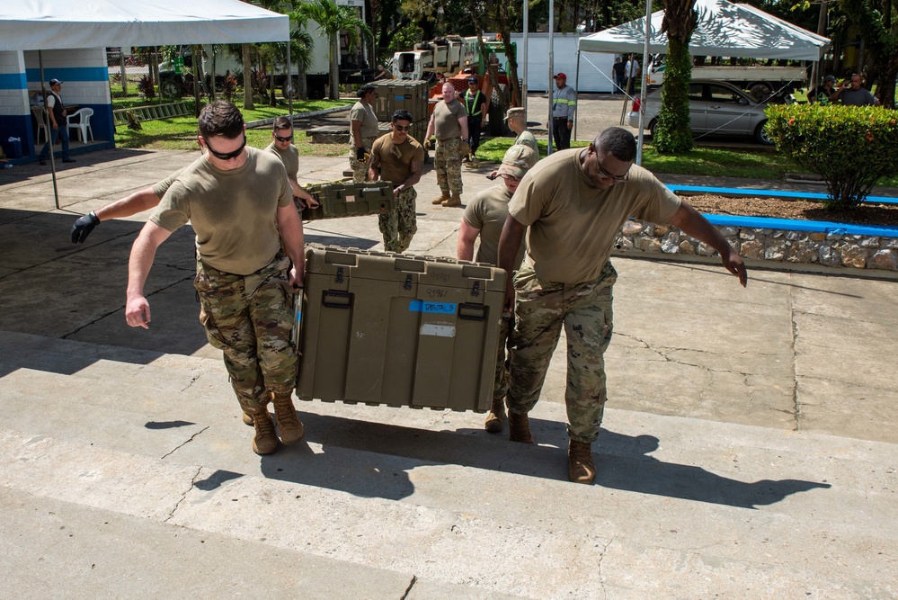 Arkansas Air National Guard members unload equipment for Continuing Promise 2022