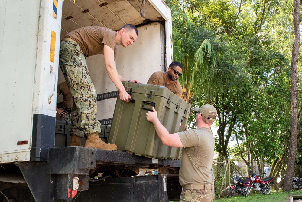 Arkansas Air National Guard members unload equipment for Continuing Promise 2022