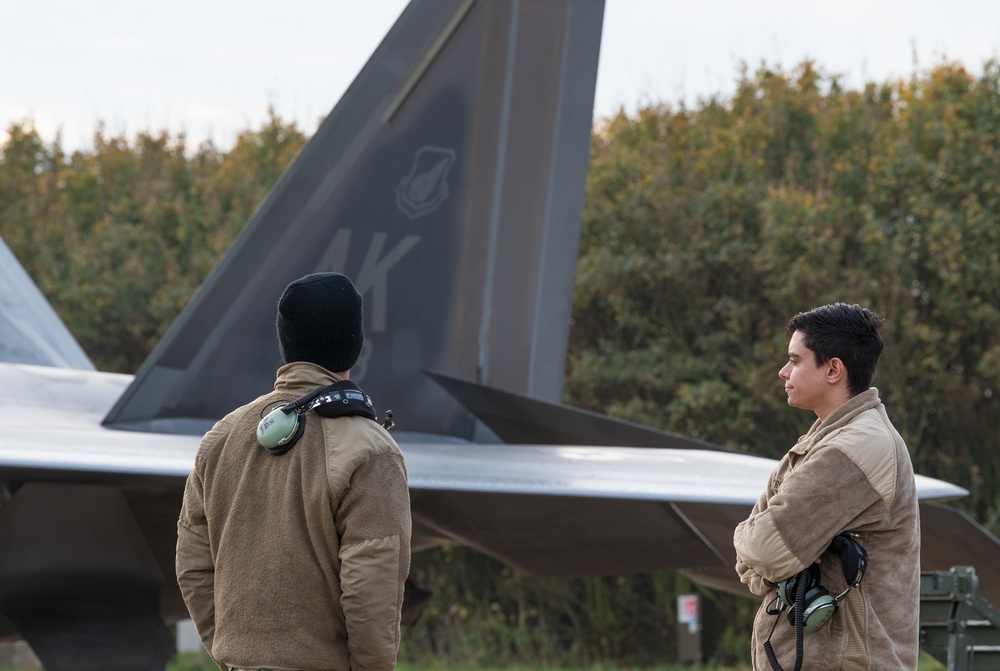 U.S. Air Force F-22 Raptors from the 90th Expeditionary Fighter Squadron integrate with the Royal Netherlands Air Force at Leeuwarden Air Base, Netherlands