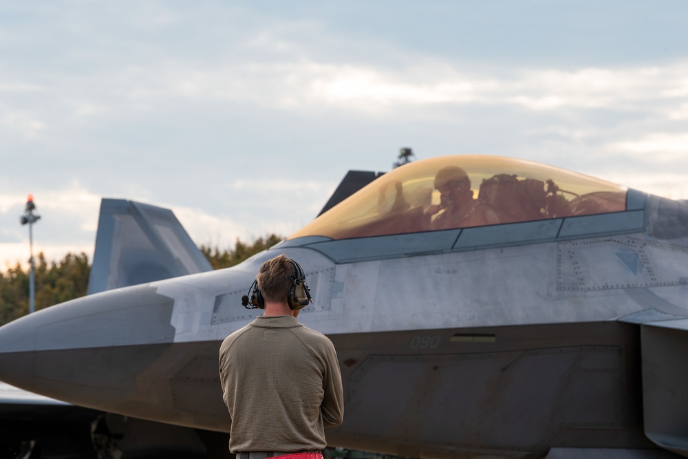 U.S. Air Force F-22 Raptors from the 90th Expeditionary Fighter Squadron integrate with the Royal Netherlands Air Force at Leeuwarden Air Base, Netherlands