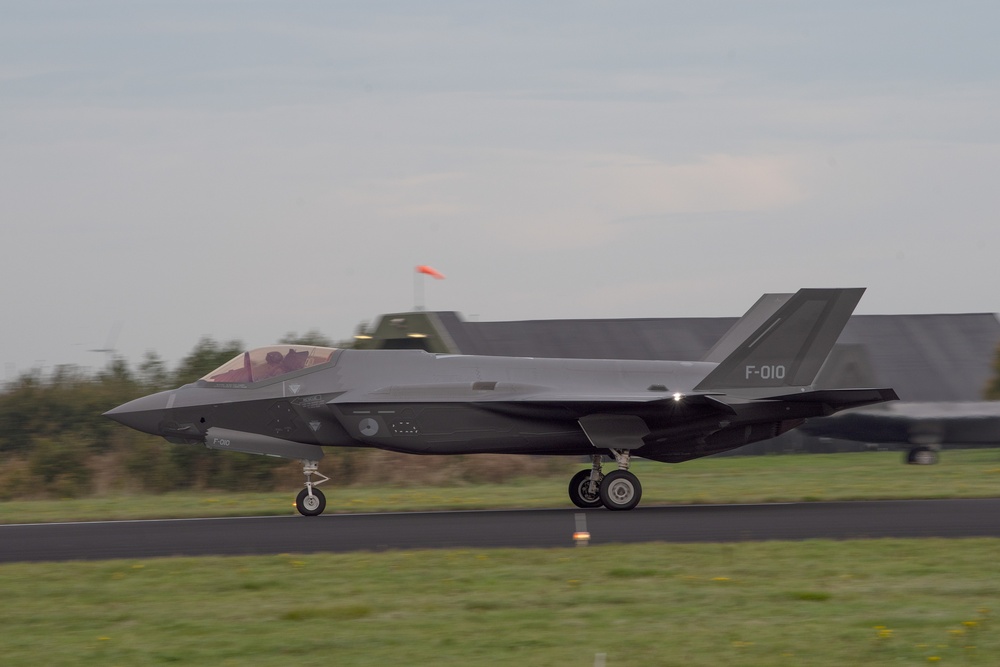 U.S. Air Force F-22 Raptors from the 90th Expeditionary Fighter Squadron integrate with the Royal Netherlands Air Force at Leeuwarden Air Base, Netherlands