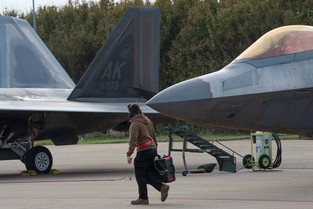 U.S. Air Force F-22 Raptors from the 90th Expeditionary Fighter Squadron integrate with the Royal Netherlands Air Force at Leeuwarden Air Base, Netherlands