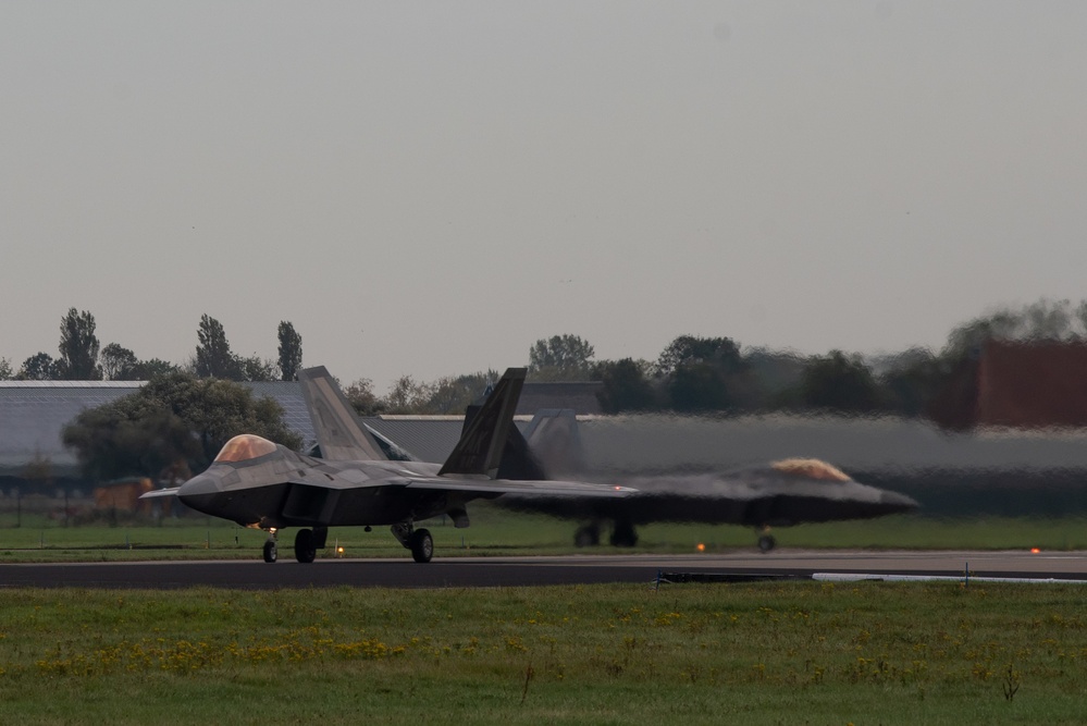 U.S. Air Force F-22 Raptors from the 90th Expeditionary Fighter Squadron integrate with the Royal Netherlands Air Force at Leeuwarden Air Base, Netherlands