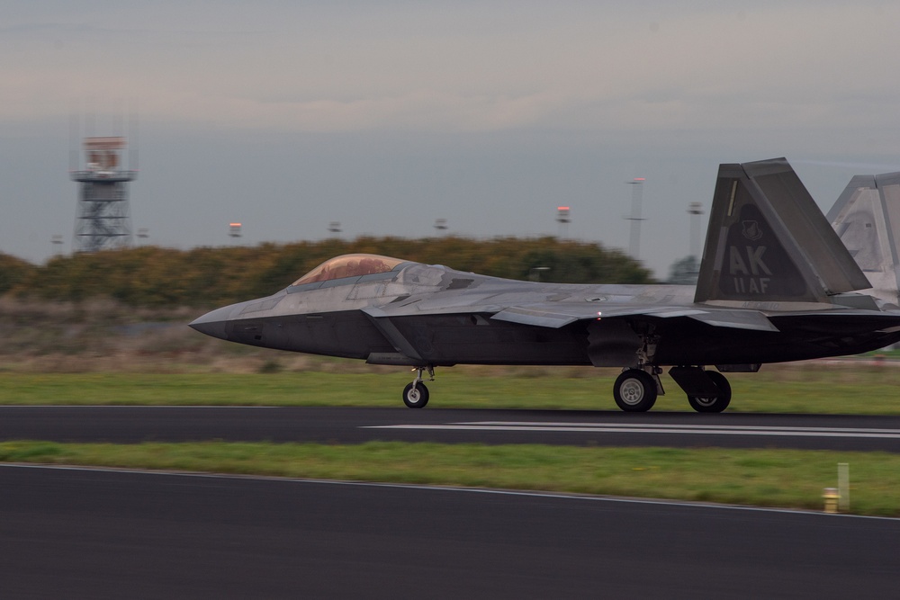 U.S. Air Force F-22 Raptors from the 90th Expeditionary Fighter Squadron integrate with the Royal Netherlands Air Force at Leeuwarden Air Base, Netherlands