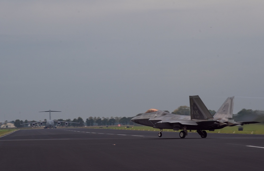 U.S. Air Force F-22 Raptors from the 90th Expeditionary Fighter Squadron integrate with the Royal Netherlands Air Force at Leeuwarden Air Base, Netherlands