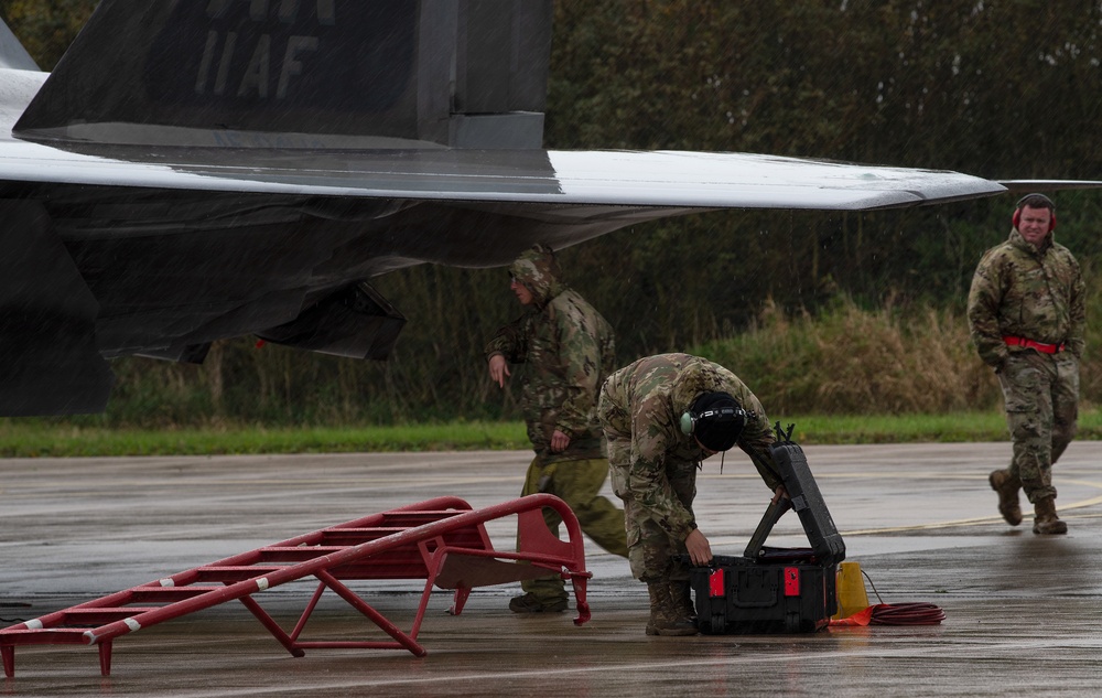 U.S. Air Force F-22 Raptors from the 90th Expeditionary Fighter Squadron integrate with the Royal Netherlands Air Force at Leeuwarden Air Base, Netherlands