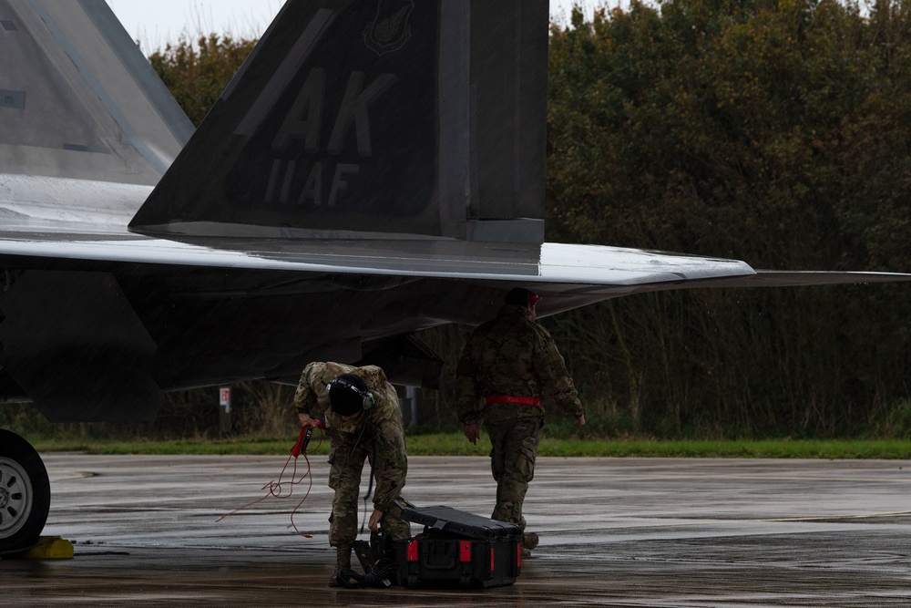 U.S. Air Force F-22 Raptors from the 90th Expeditionary Fighter Squadron integrate with the Royal Netherlands Air Force at Leeuwarden Air Base, Netherlands