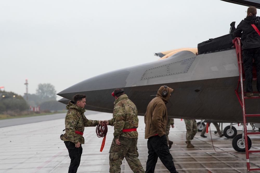 U.S. Air Force F-22 Raptors from the 90th Expeditionary Fighter Squadron integrate with the Royal Netherlands Air Force at Leeuwarden Air Base, Netherlands