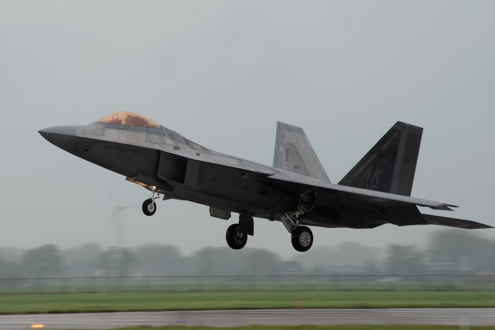 U.S. Air Force F-22 Raptors from the 90th Expeditionary Fighter Squadron integrate with the Royal Netherlands Air Force at Leeuwarden Air Base, Netherlands