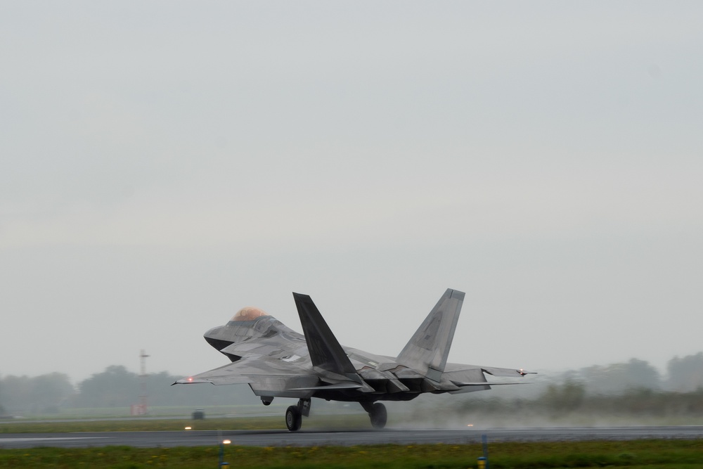 U.S. Air Force F-22 Raptors from the 90th Expeditionary Fighter Squadron integrate with the Royal Netherlands Air Force at Leeuwarden Air Base, Netherlands