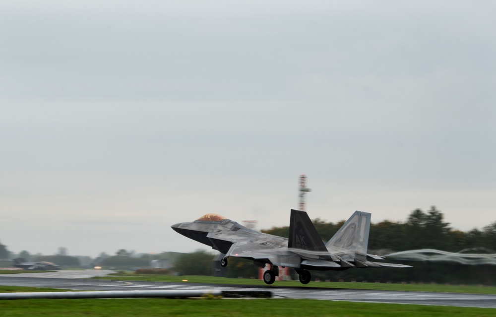 U.S. Air Force F-22 Raptors from the 90th Expeditionary Fighter Squadron integrate with the Royal Netherlands Air Force at Leeuwarden Air Base, Netherlands