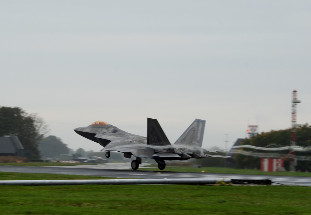 U.S. Air Force F-22 Raptors from the 90th Expeditionary Fighter Squadron integrate with the Royal Netherlands Air Force at Leeuwarden Air Base, Netherlands