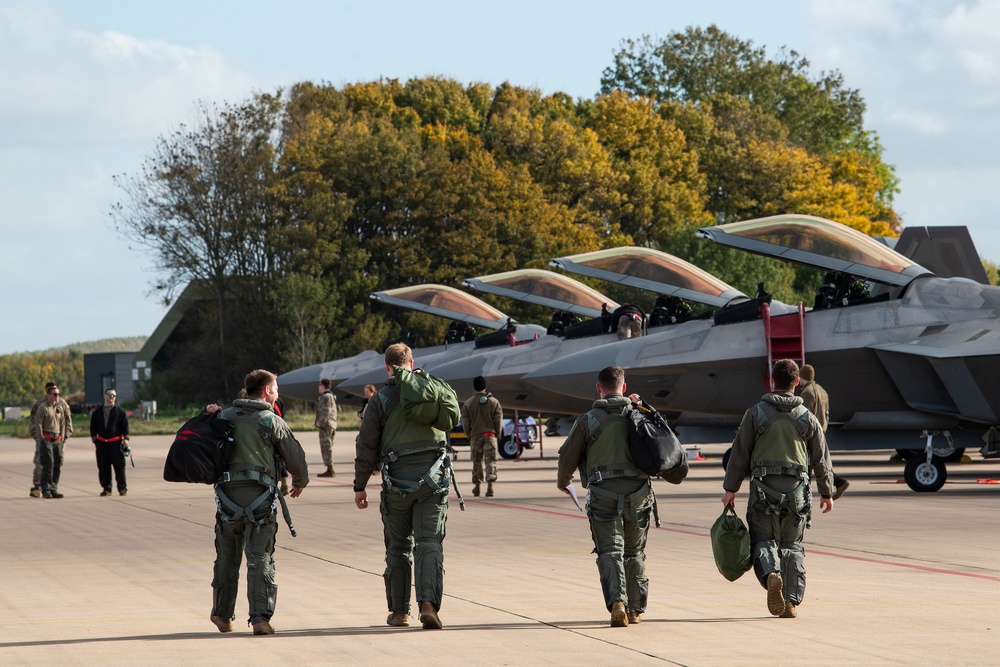 U.S. Air Force F-22 Raptors from the 90th Expeditionary Fighter Squadron integrate with the Royal Netherlands Air Force at Leeuwarden Air Base, Netherlands